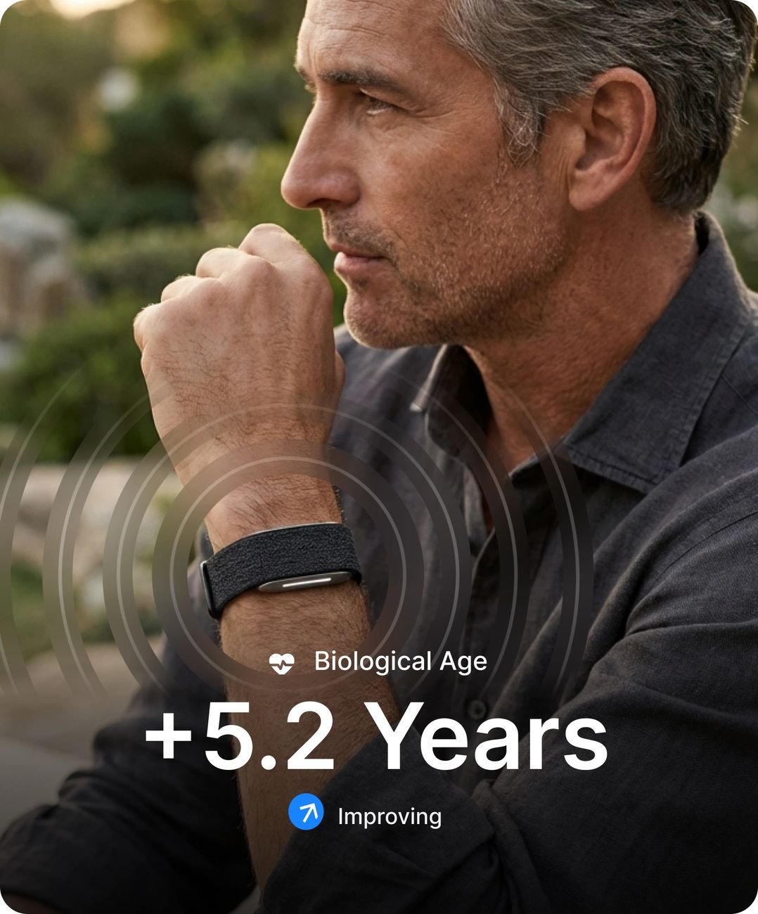 Man wearing the Hulme Band with biological age and illness risk shown in app